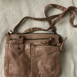 Crossbody with lots of pockets. Great for concerts or a day on the town.